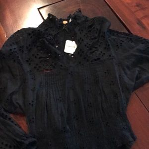 Free People eyelet tunic with cinched waist.